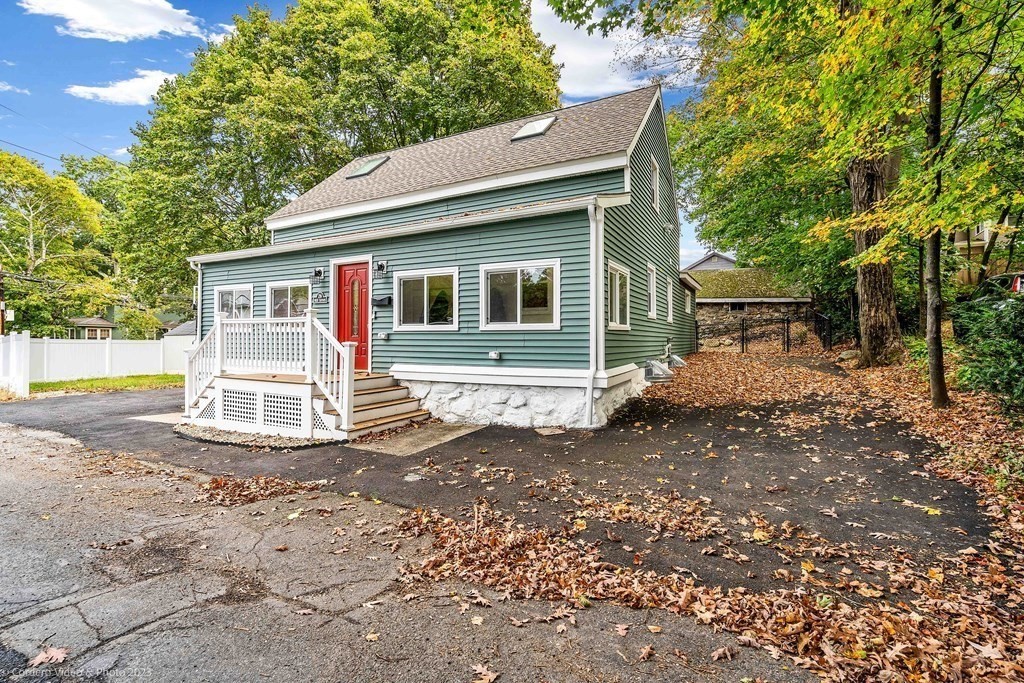 26 Mill Street Maynard, MA 01754 - Photo 4 of 29 a view of a house with a yard