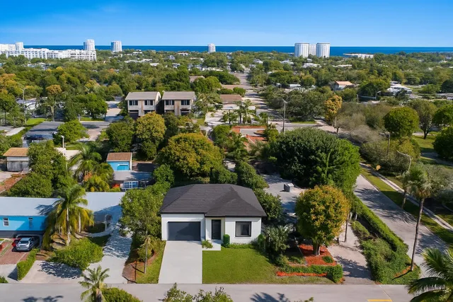 an aerial view of residential houses with outdoor space