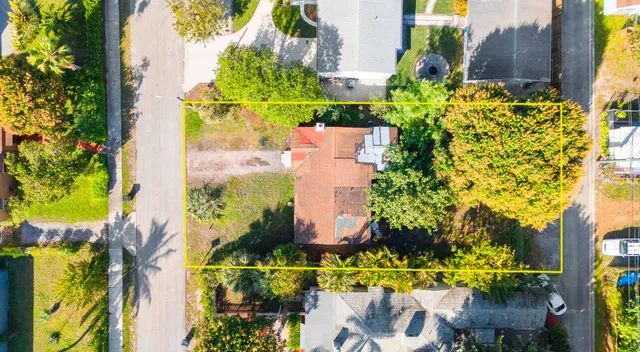 an aerial view of a residential building with swimming pool