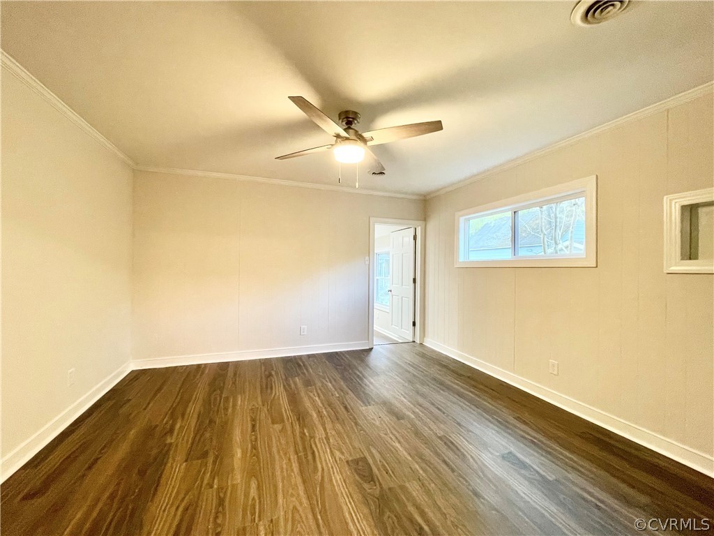 11300 Buckley Hall Road Mathews, VA 23109 - Photo 16 of 31 an empty room with wooden floor and windows