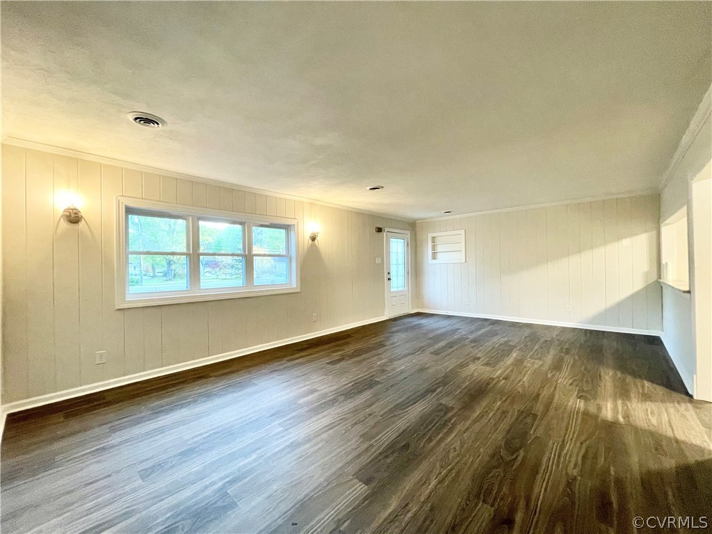 11300 Buckley Hall Road Mathews, VA 23109 - Photo 3 of 31 an empty room with wooden floor and windows