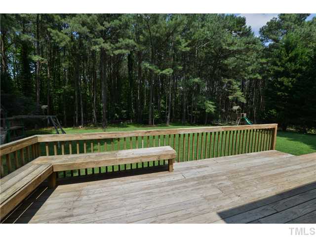 13612 Durant Road Raleigh, NC 27614 - Photo 20 of 20 a view of a wooden deck with a bench