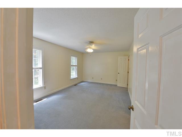 13612 Durant Road Raleigh, NC 27614 - Photo 6 of 20 a view of an empty room with window and closet area