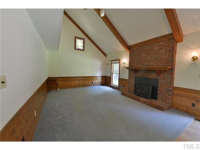 13612 Durant Road Raleigh, NC 27614 - Photo 7 of 20 a view of empty room with a fireplace