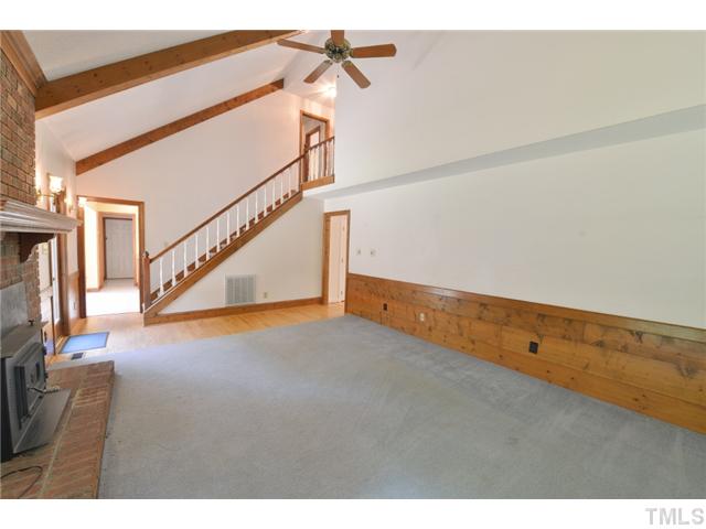13612 Durant Road Raleigh, NC 27614 - Photo 8 of 20 a view of an empty room with stairs