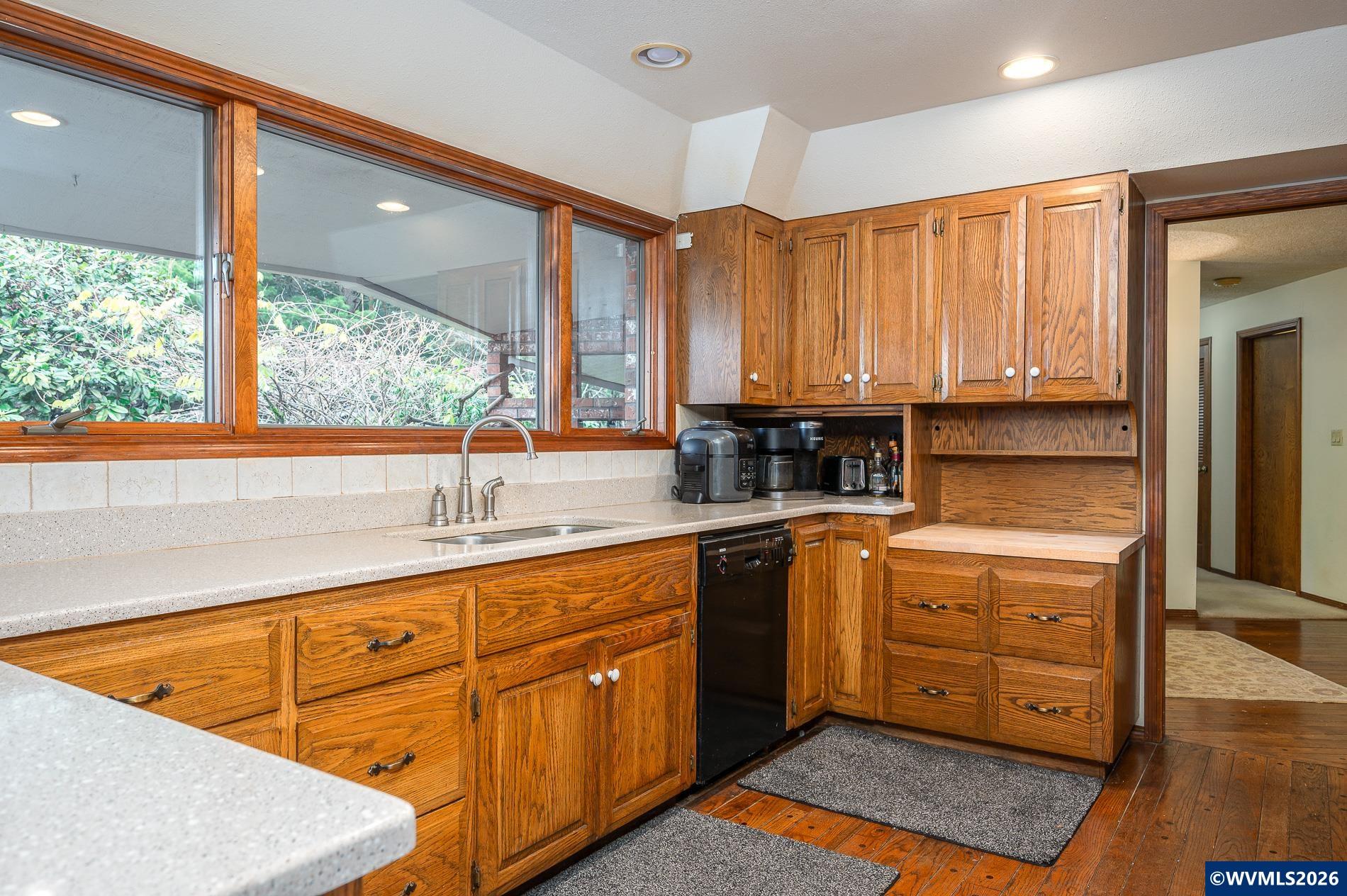 27572 South Kinzy Road Estacada, OR 97023 - Photo 15 of 50 a kitchen with stainless steel appliances granite countertop a sink window and cabinets