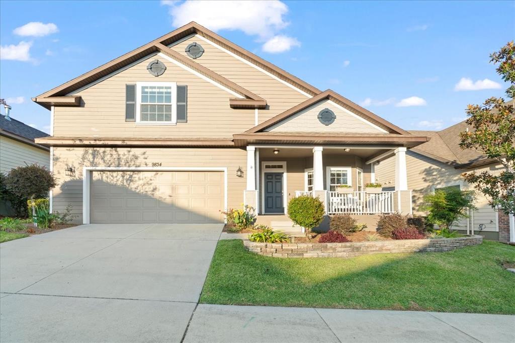 a front view of a house with a yard table and chairs