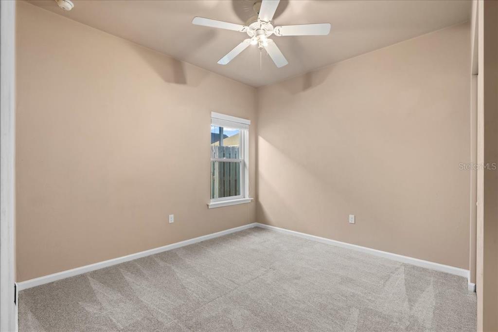 9834 Northwest 17th Road Gainesville, FL 32606 - Photo 22 of 51 an empty room with windows and fan