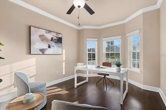 a view of a livingroom with furniture and a large window