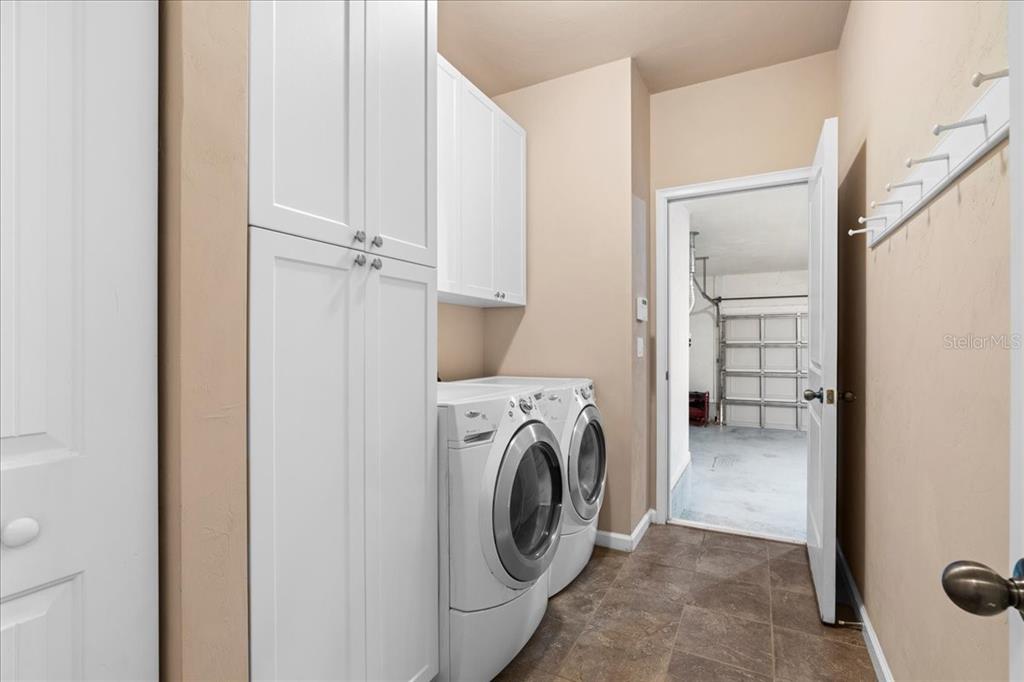 9834 Northwest 17th Road Gainesville, FL 32606 - Photo 36 of 51 a view of a storage & utility room with washer and dryer