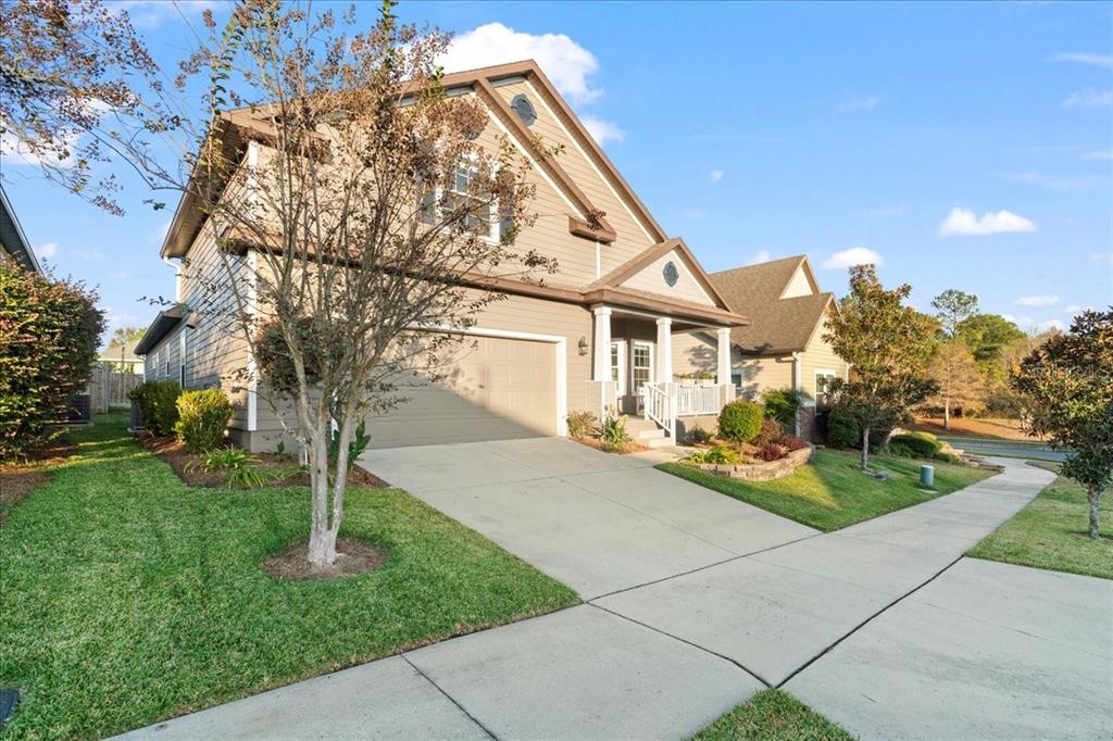 9834 Northwest 17th Road Gainesville, FL 32606 - Photo 40 of 51 a front view of a house with garden