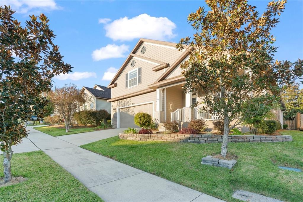 9834 Northwest 17th Road Gainesville, FL 32606 - Photo 41 of 51 a front view of a house with garden