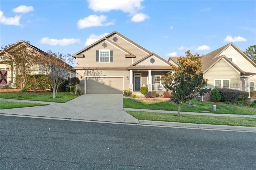 9834 Northwest 17th Road Gainesville, FL 32606 - Photo 42 of 51 a front view of a house with a yard