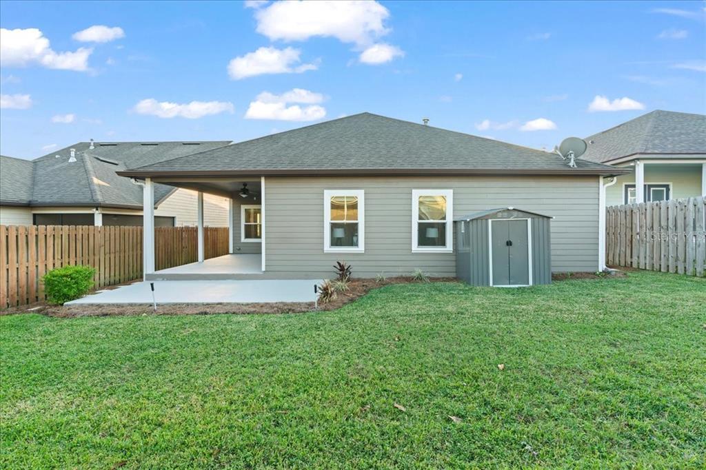 9834 Northwest 17th Road Gainesville, FL 32606 - Photo 44 of 51 a front view of a house with a yard