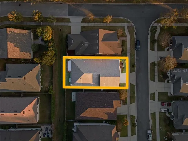 an aerial view of a house with a swimming pool