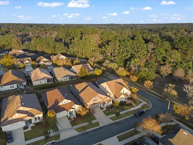 an aerial view of a house with a ocean view
