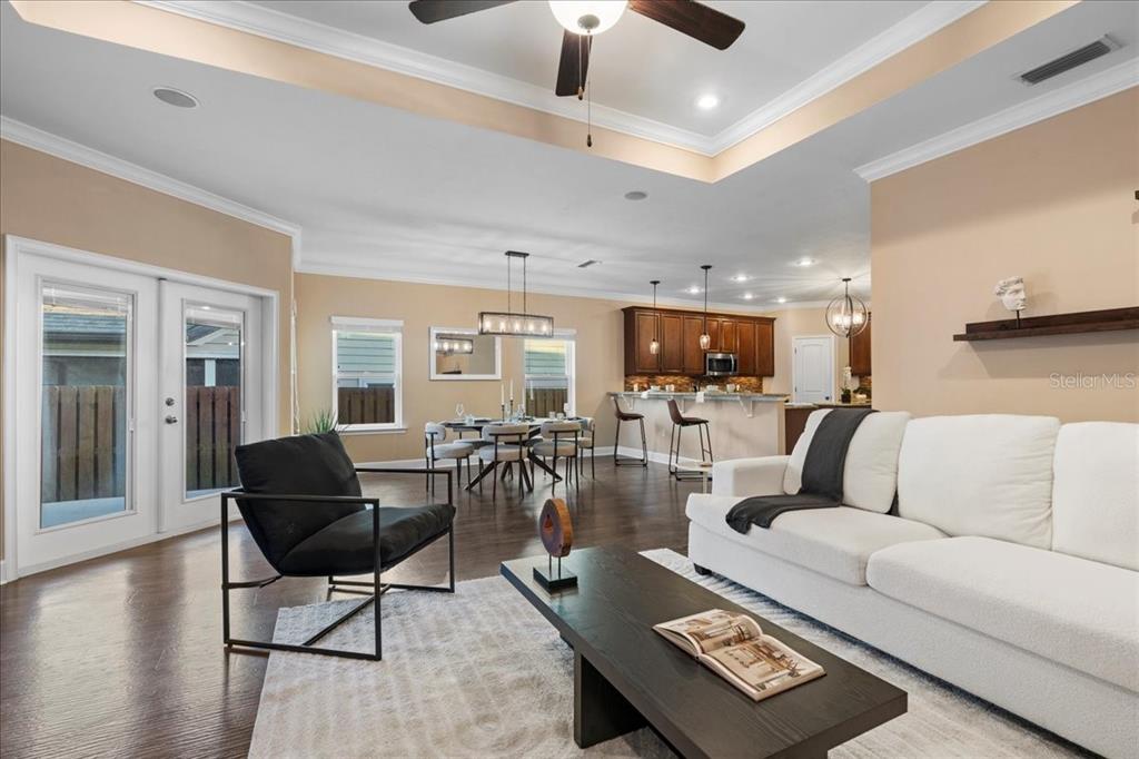 9834 Northwest 17th Road Gainesville, FL 32606 - Photo 9 of 51 a living room with furniture and wooden floor