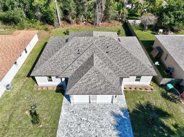 a view of a backyard with plants