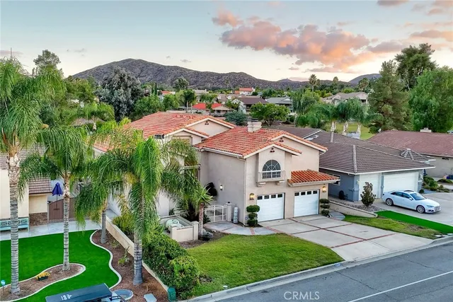 a view of house with garden space and street view