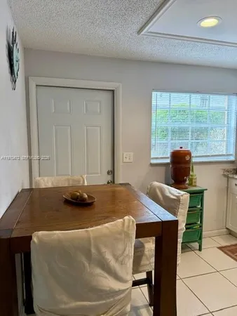 a dining room with a table and chairs in it