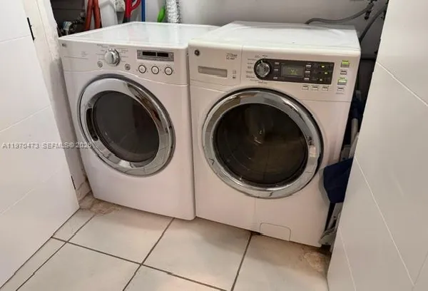 a utility room with dryer and washer