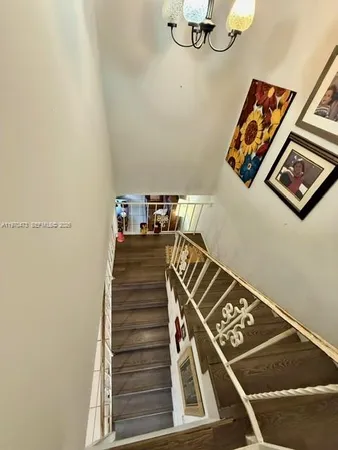 a view of staircase with white walls
