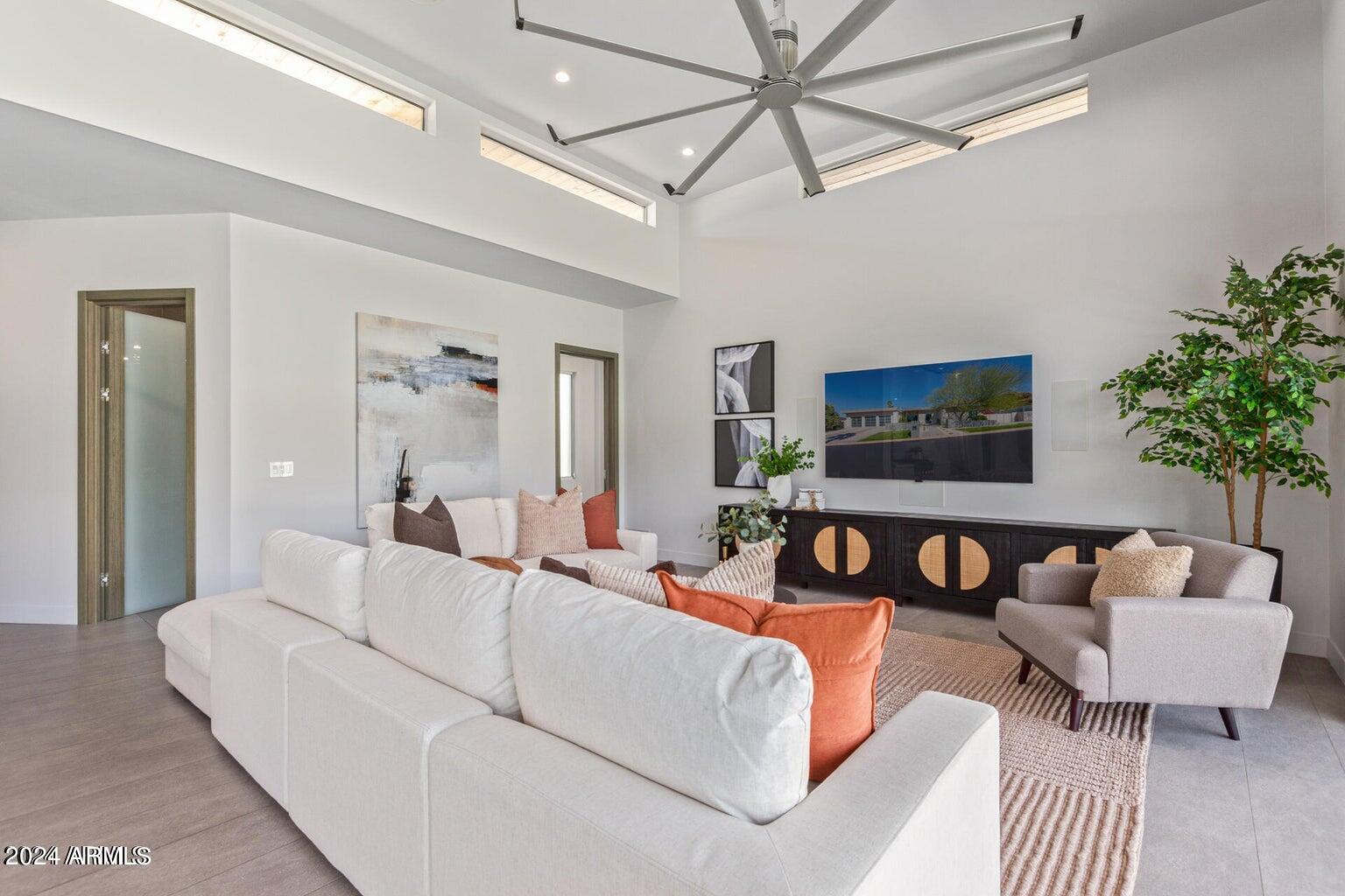 5833 North 46th Street Phoenix, AZ 85018 - Photo 12 of 29 a living room with furniture and a flat screen tv