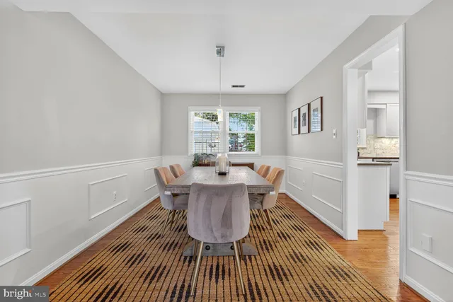 a view of a dining room with furniture and window