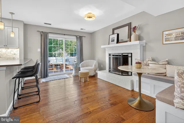 a view of kitchen with furniture and wooden floor