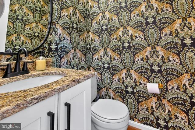 a view of entryway with wooden floor and stairs