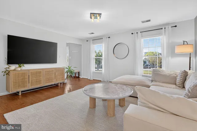 a living room with furniture and a rug