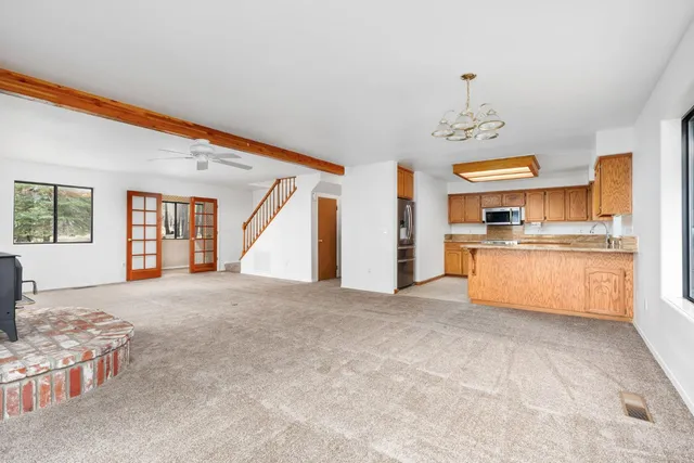 a large kitchen with a stove and cabinets