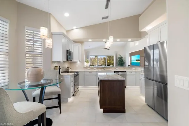 a kitchen with a sink stove and microwave