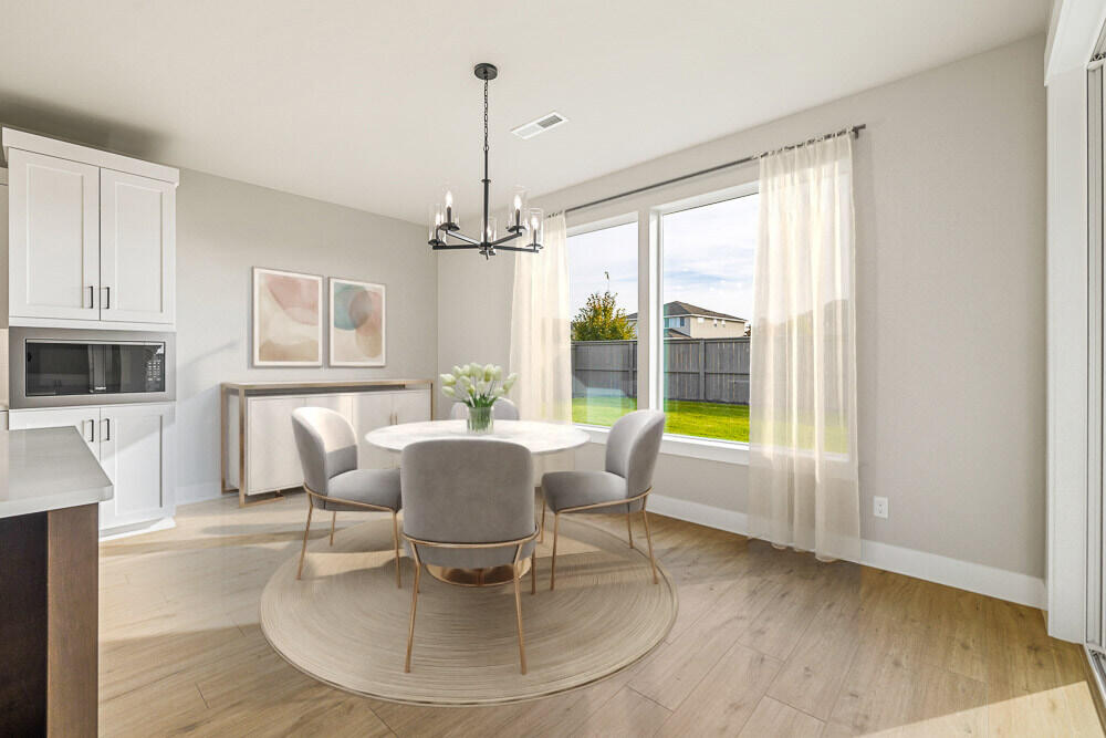 3973 Northeast Oakside Loop Bend, OR 97701 - Photo 6 of 26 Second dining. Images of like kind room and have been virtually staged. colors may vary.