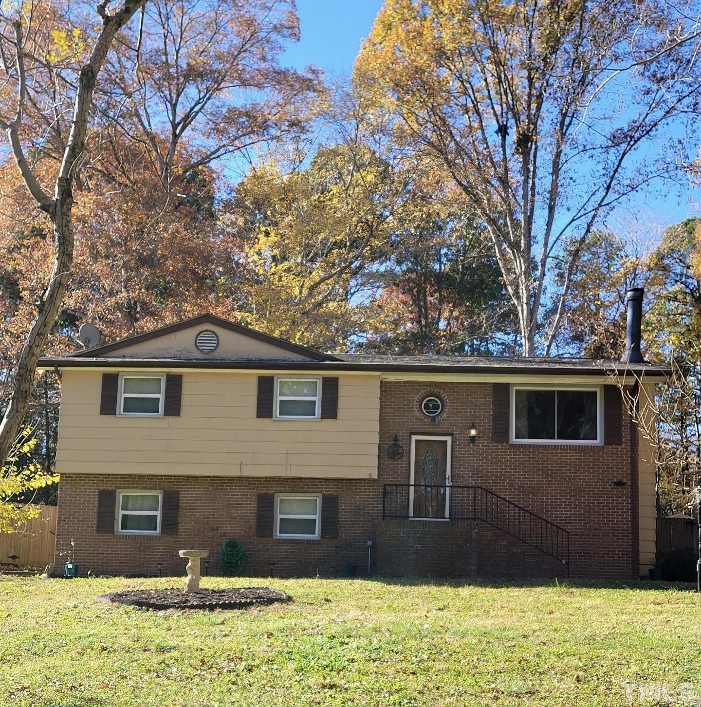 5200 Olive Road Raleigh, NC 27606 - Photo 1 of 28 a front view of a house with garden