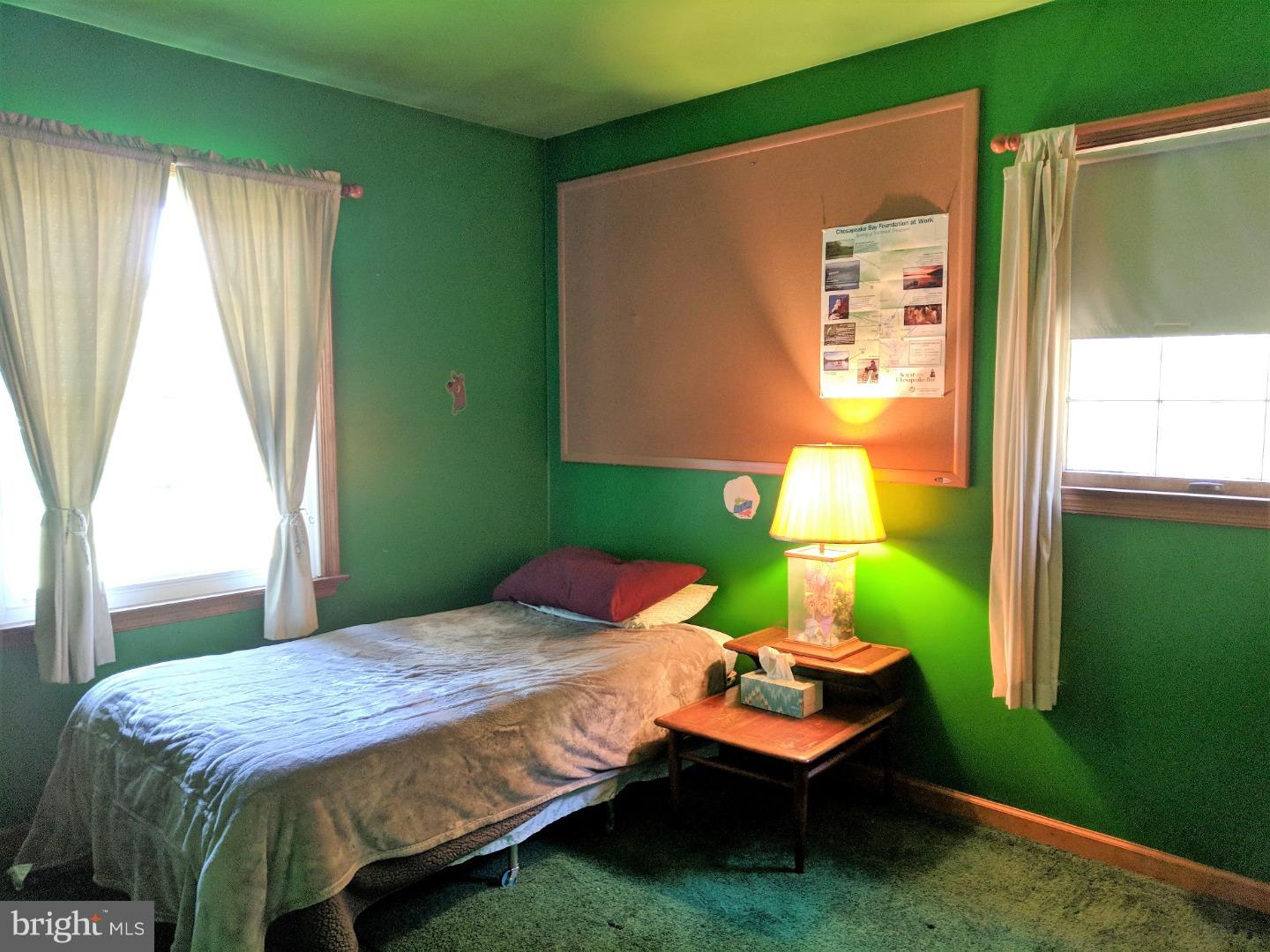 1144 Upper Van Reed Road Leesport, PA 19533 - Photo 14 of 25 a bedroom with a bed table and chair