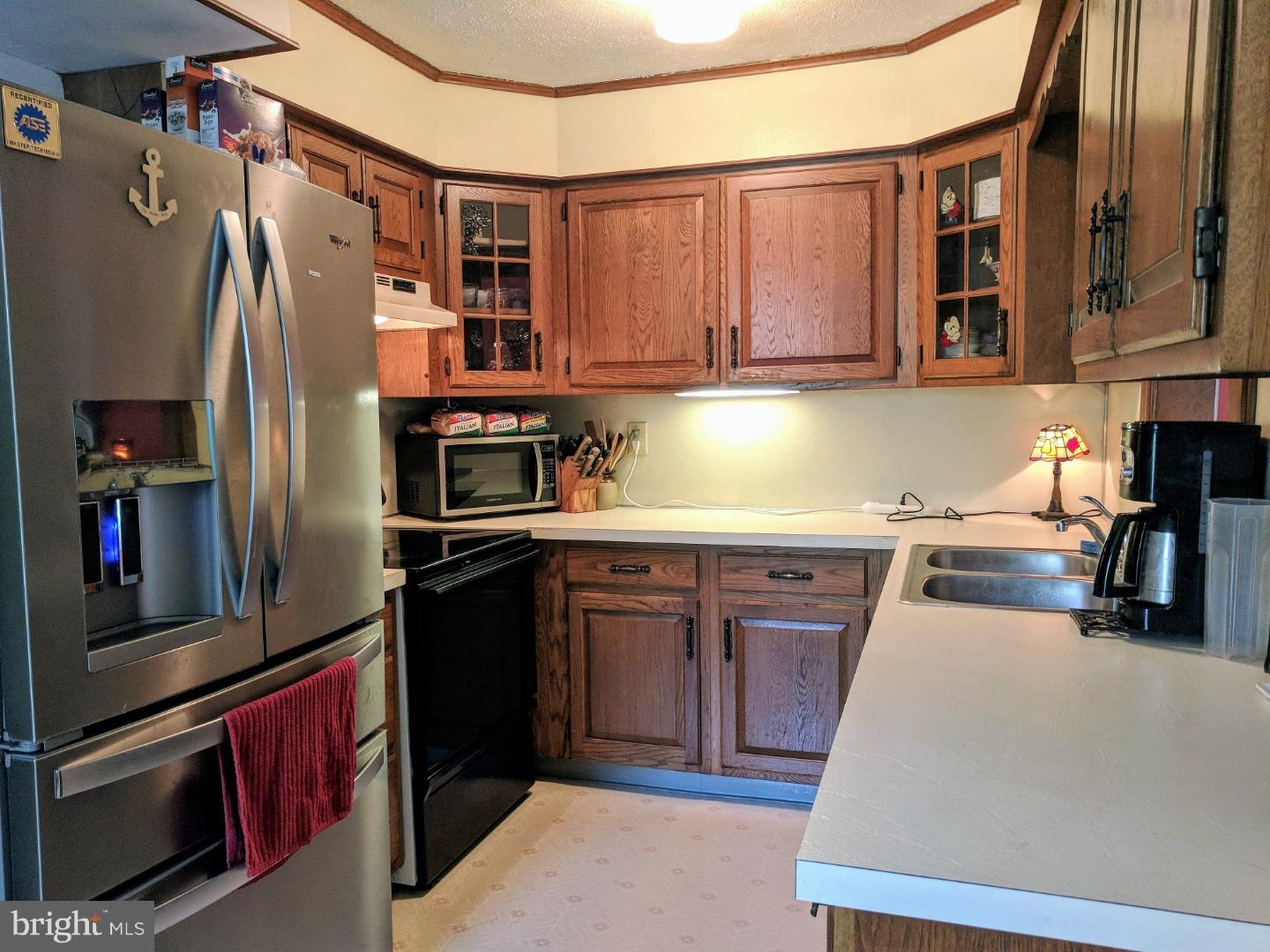 1144 Upper Van Reed Road Leesport, PA 19533 - Photo 3 of 25 a kitchen with stainless steel appliances granite countertop a refrigerator and a stove top oven