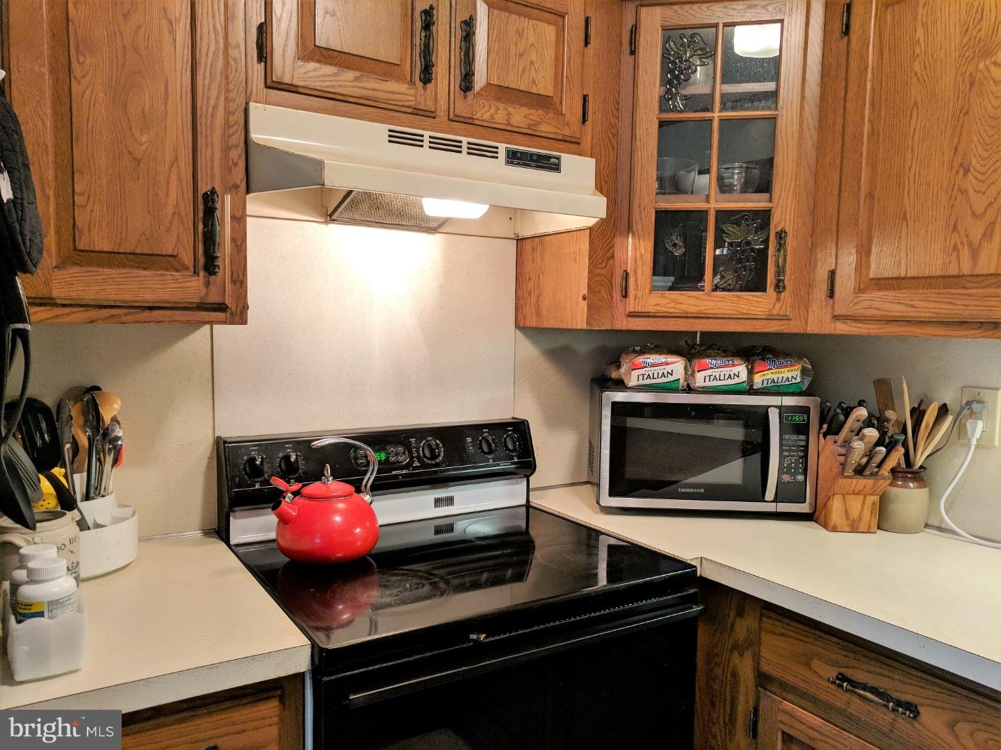 1144 Upper Van Reed Road Leesport, PA 19533 - Photo 4 of 25 a kitchen with stainless steel appliances a stove and a microwave