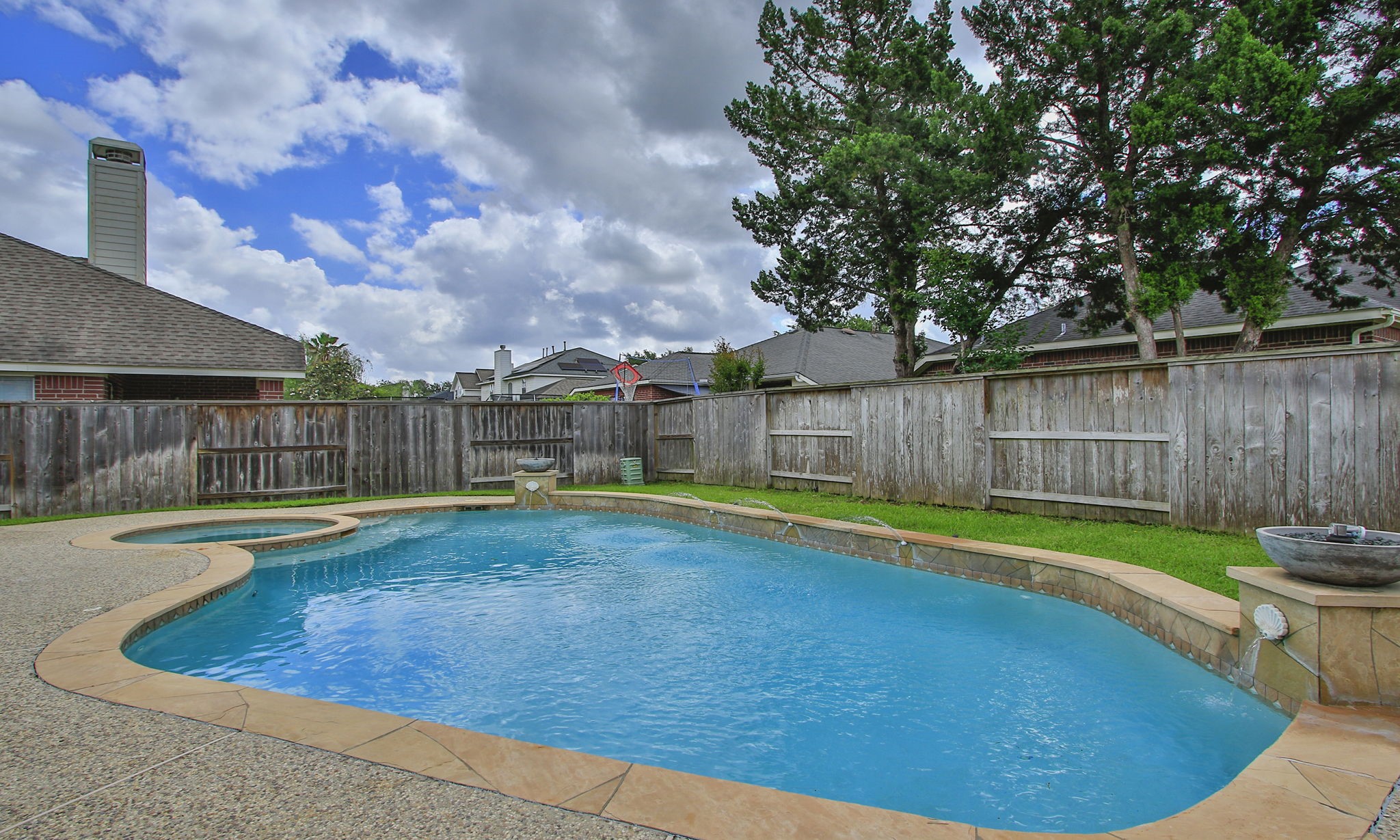 1210 Berwick Manor Court Spring, TX 77379 - Photo 45 of 50 a view of a backyard with swimming pool