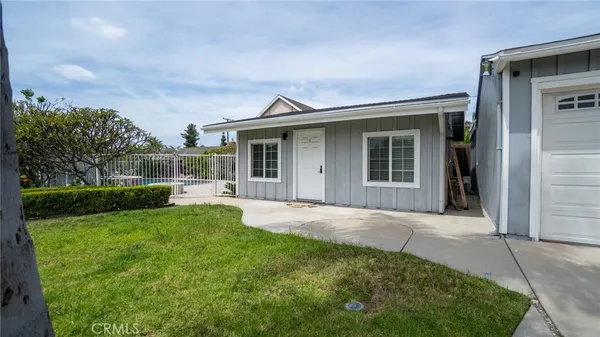 a front view of a house with a yard and porch