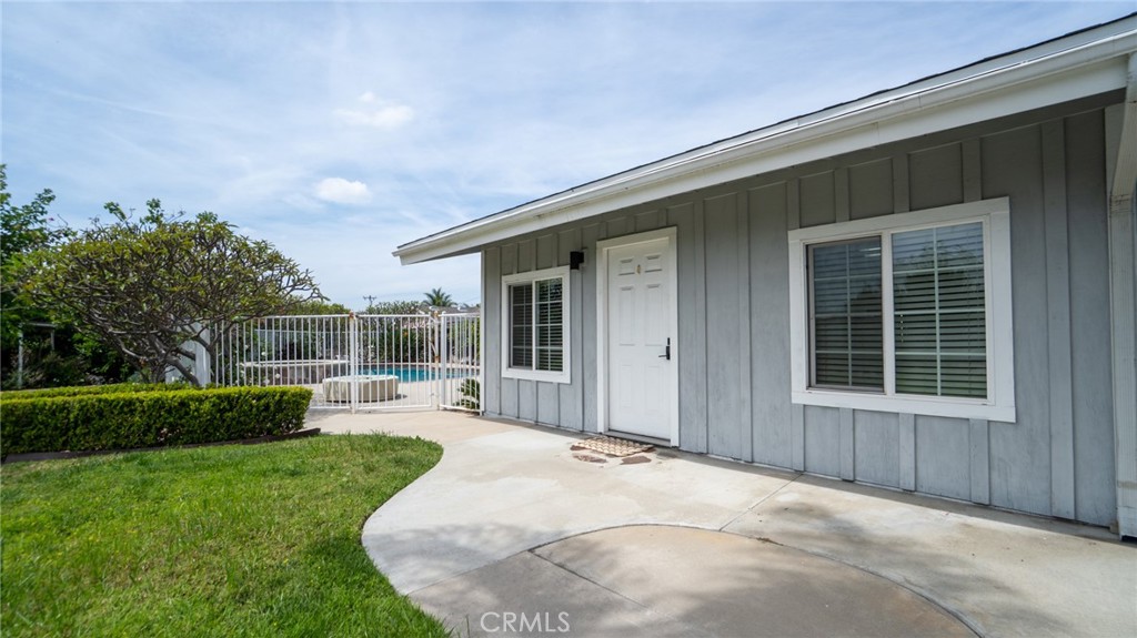 11921 Stamy Road La Mirada, CA 90638 - Photo 17 of 21 front view of a house with yard and porch