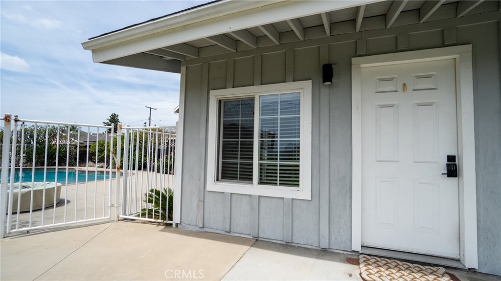 11921 Stamy Road La Mirada, CA 90638 - Photo 19 of 21 a view of a house with a small yard and wooden floor and fence