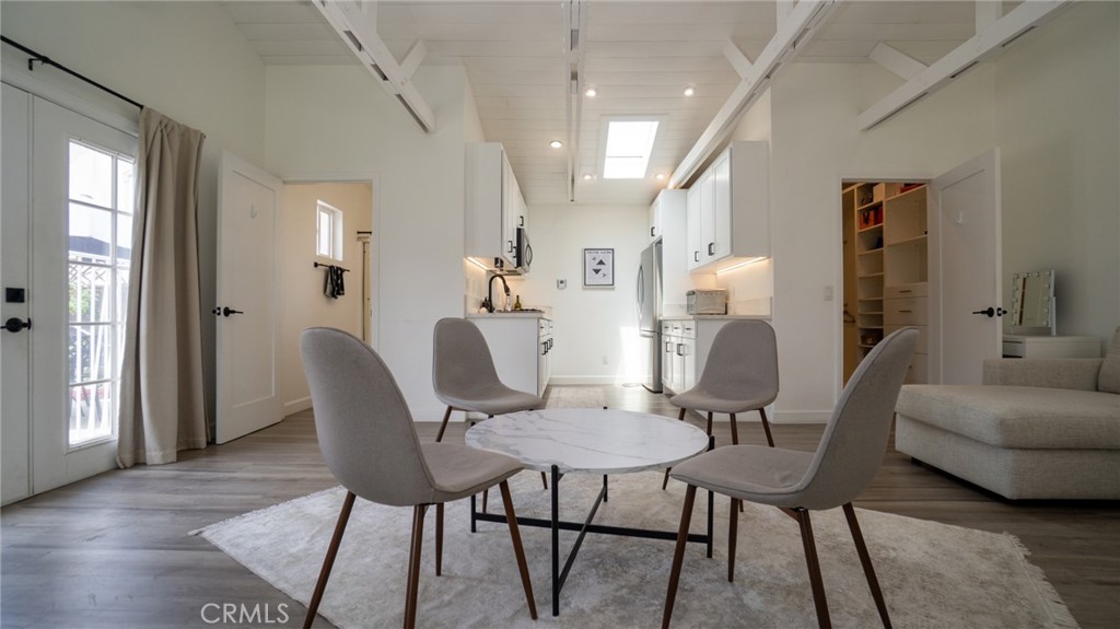 11921 Stamy Road La Mirada, CA 90638 - Photo 2 of 21 a view of a dining room with furniture and wooden floor