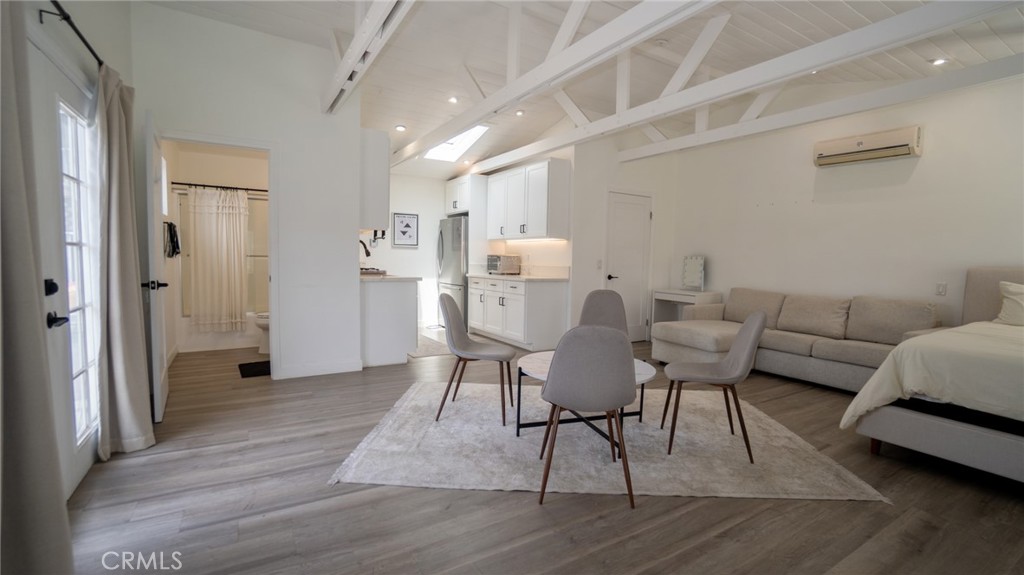 11921 Stamy Road La Mirada, CA 90638 - Photo 4 of 21 a dining room with furniture and wooden floor