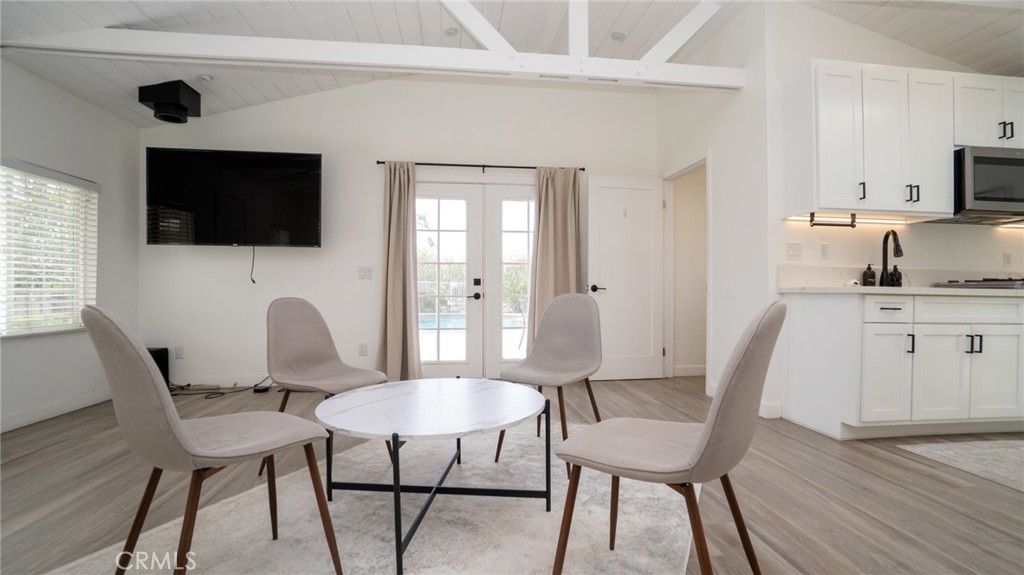 11921 Stamy Road La Mirada, CA 90638 - Photo 7 of 21 a view of a dining room with furniture and wooden floor