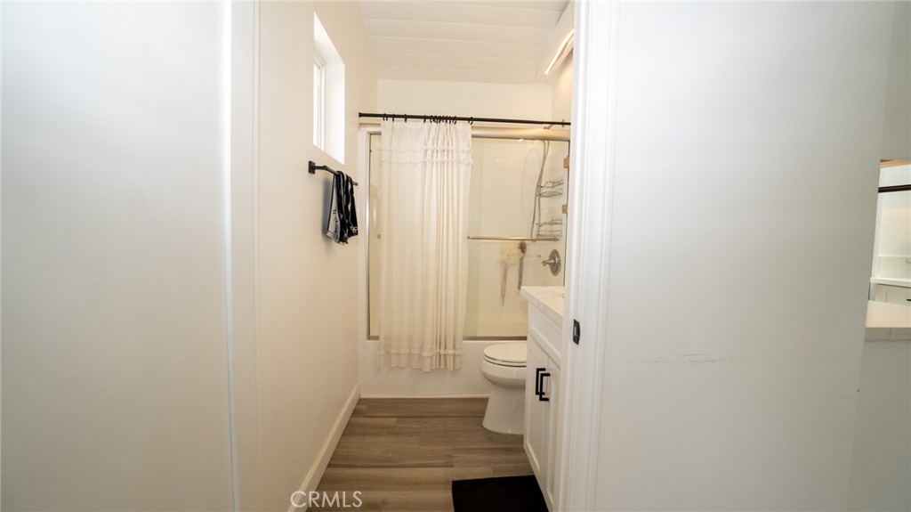 11921 Stamy Road La Mirada, CA 90638 - Photo 9 of 21 a bathroom with a shower and a toilet