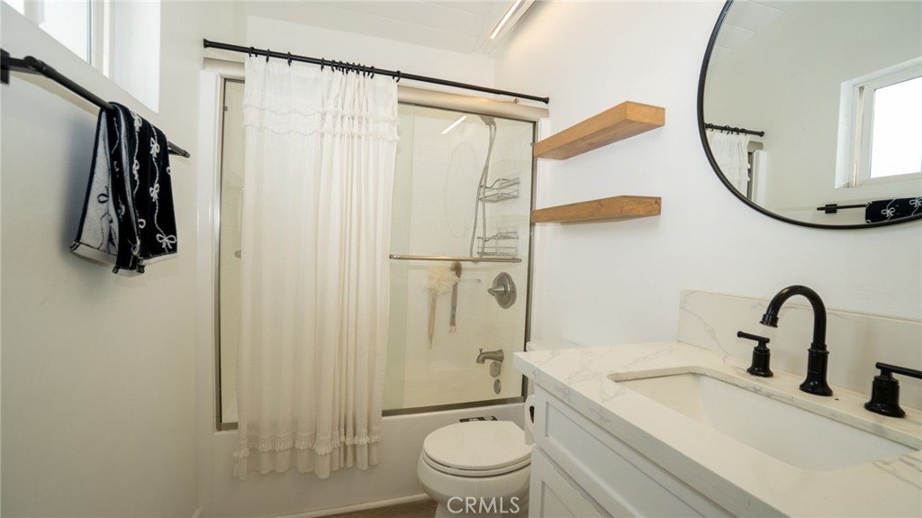 11921 Stamy Road La Mirada, CA 90638 - Photo 10 of 21 a bathroom with a sink toilet and shower
