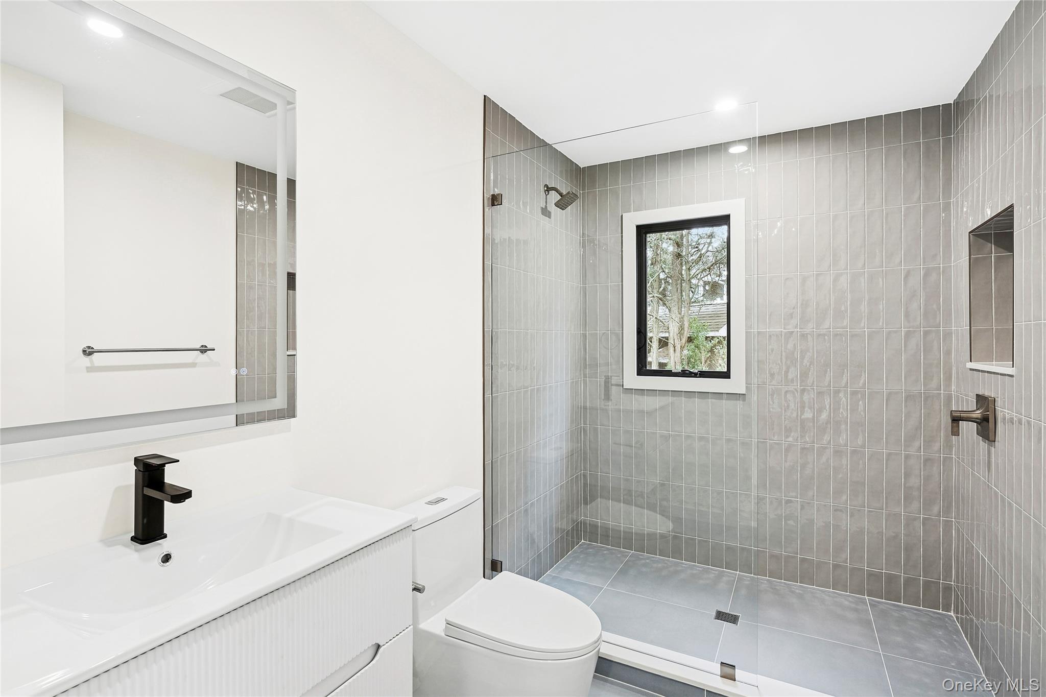 3 Shore Lane Westhampton, NY 11977 - Photo 9 of 17 Bathroom featuring vanity, walk in shower, and recessed lighting