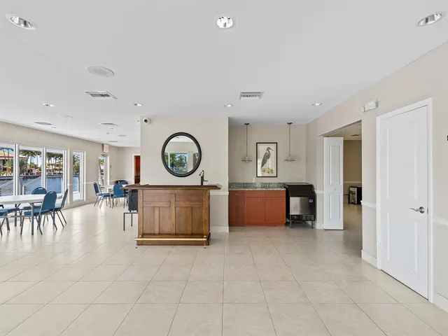 a backyard of a house with barbeque oven table and chairs