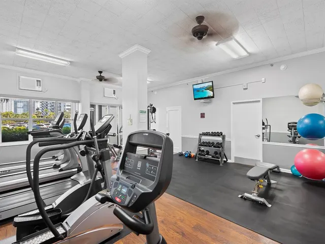 a view of a livingroom with furniture and a ceiling fan